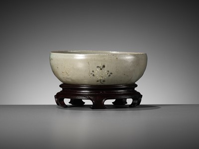 Lot 466 - A SLIP-INLAID CELADON-GLAZED STONEWARE ‘FLORAL’ BOWL, GORYEO DYNASTY