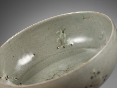 Lot 466 - A SLIP-INLAID CELADON-GLAZED STONEWARE ‘FLORAL’ BOWL, GORYEO DYNASTY