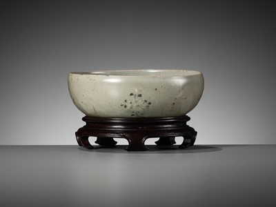 Lot 466 - A SLIP-INLAID CELADON-GLAZED STONEWARE ‘FLORAL’ BOWL, GORYEO DYNASTY