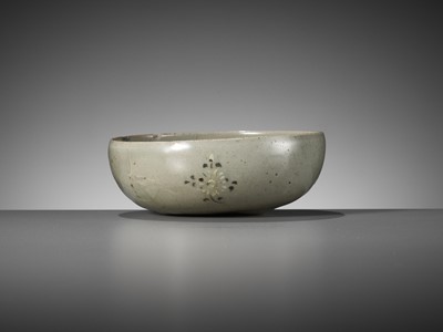 Lot 466 - A SLIP-INLAID CELADON-GLAZED STONEWARE ‘FLORAL’ BOWL, GORYEO DYNASTY