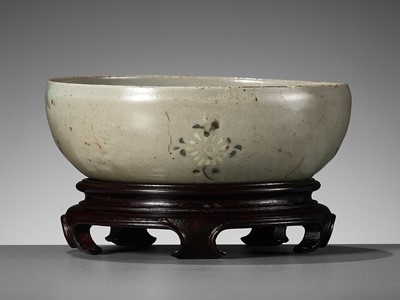 Lot 466 - A SLIP-INLAID CELADON-GLAZED STONEWARE ‘FLORAL’ BOWL, GORYEO DYNASTY