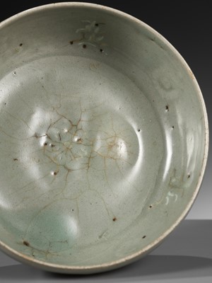 Lot 466 - A SLIP-INLAID CELADON-GLAZED STONEWARE ‘FLORAL’ BOWL, GORYEO DYNASTY