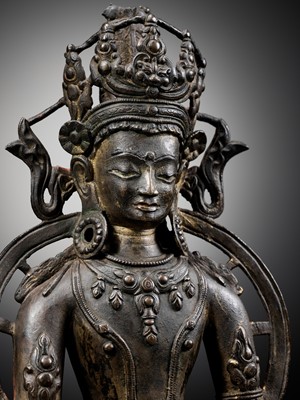 Lot 174 - A LARGE BRONZE FIGURE OF RATNASAMBHAVA, CENTRAL TIBET, 13TH-14TH CENTURY