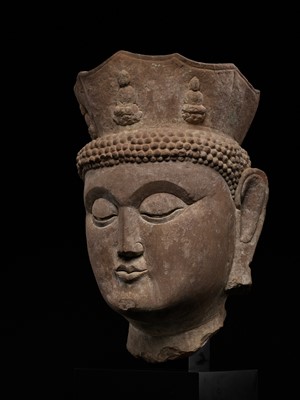 Lot 168 - A MONUMENTAL HEAD OF VAIROCANA, THE PRIMORDIAL BUDDHA, CIRCA 500-800 AD