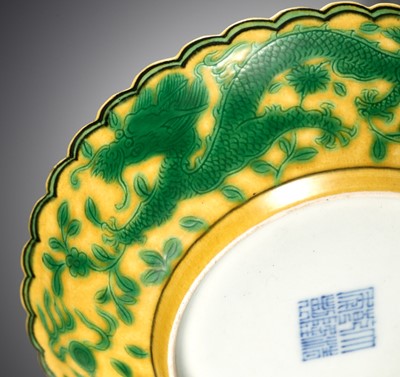 Lot 117 - A PAIR OF YELLOW-GROUND AND GREEN-ENAMELLED 'DRAGON' DISHES, QIANLONG MARK AND OF THE PERIOD