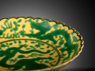 Lot 117 - A PAIR OF YELLOW-GROUND AND GREEN-ENAMELLED 'DRAGON' DISHES, QIANLONG MARK AND OF THE PERIOD