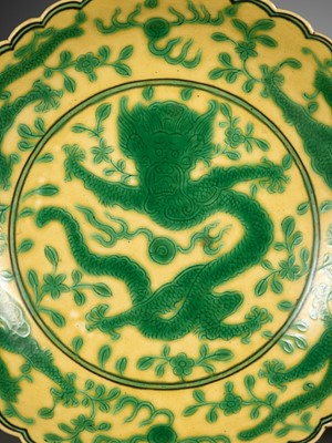 Lot 117 - A PAIR OF YELLOW-GROUND AND GREEN-ENAMELLED 'DRAGON' DISHES, QIANLONG MARK AND OF THE PERIOD