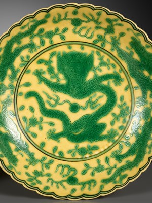 Lot 117 - A PAIR OF YELLOW-GROUND AND GREEN-ENAMELLED 'DRAGON' DISHES, QIANLONG MARK AND OF THE PERIOD