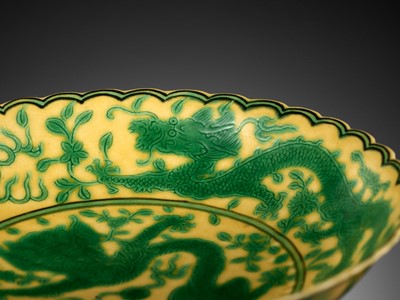 Lot 117 - A PAIR OF YELLOW-GROUND AND GREEN-ENAMELLED 'DRAGON' DISHES, QIANLONG MARK AND OF THE PERIOD