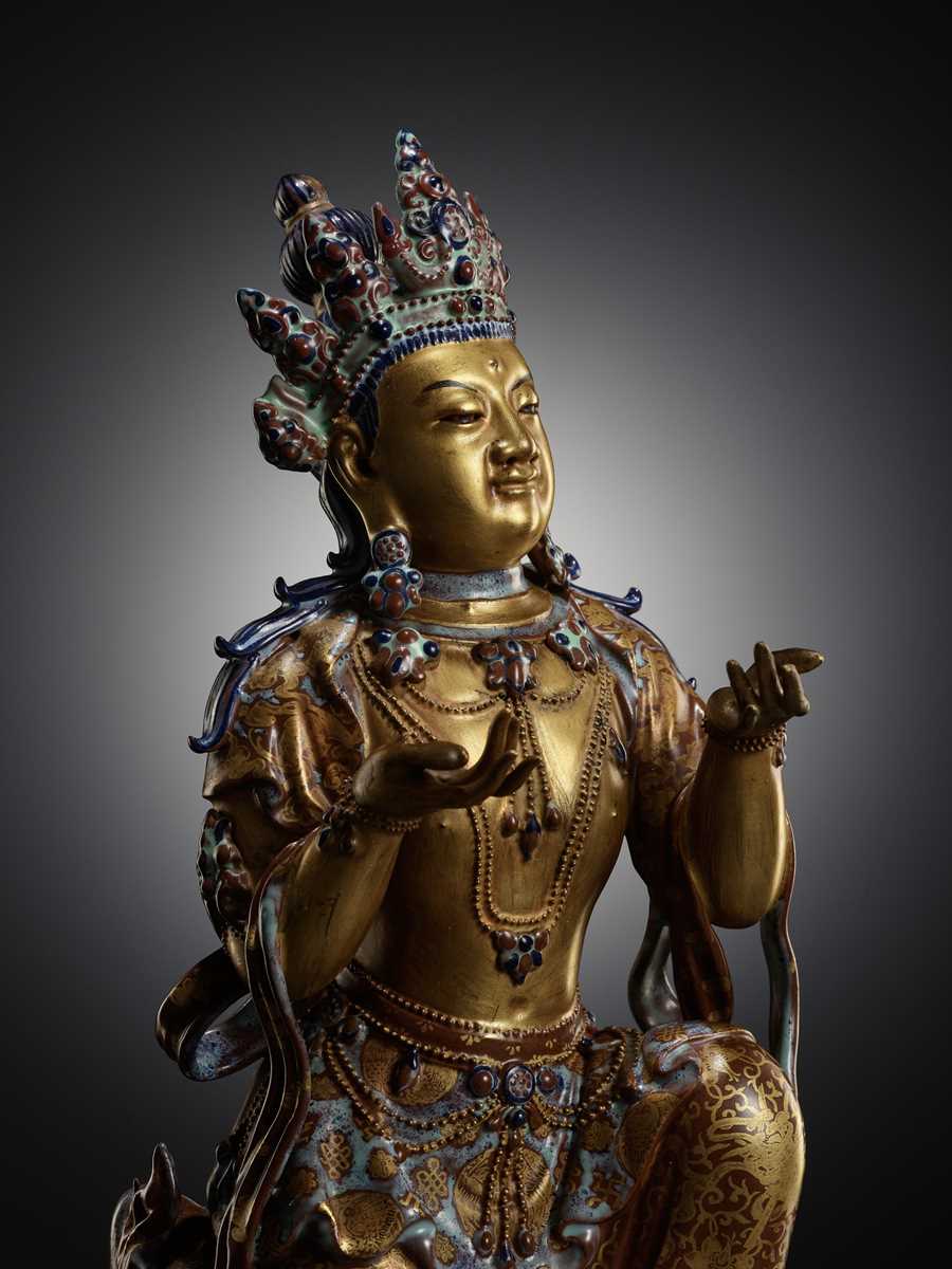 Lot 121 - A ROBIN’S-EGG-GLAZED AND GILT PORCELAIN FIGURE OF A BODHISATTVA, QIANLONG TO JIAQING PERIOD