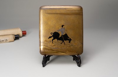 Lot 8 - A LACQUER SUZURIBAKO DEPICTING AN OX-HERDER PLAYING THE FLUTE