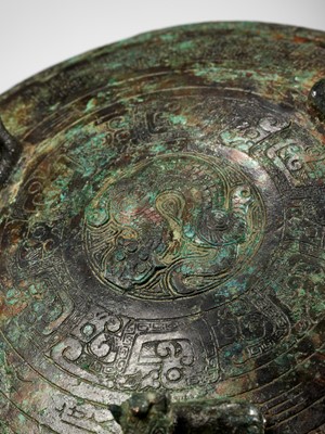 Lot 143 - A LARGE INSCRIBED BRONZE RITUAL FOOD VESSEL AND COVER, DING, SPRING AND AUTUMN PERIOD