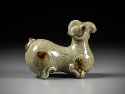 Lot 64 - A RARE IRON-SPLASHED ‘YUE’ FIGURE OF A RECUMBENT RAM, WESTERN JIN DYNASTY