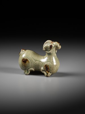 Lot 64 - A RARE IRON-SPLASHED ‘YUE’ FIGURE OF A RECUMBENT RAM, WESTERN JIN DYNASTY