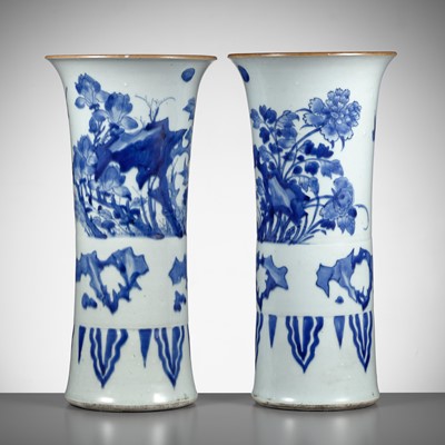 Lot 90 - A PAIR OF BLUE AND WHITE ‘MAGNOLIA’ BEAKER VASES, TRANSITIONAL PERIOD