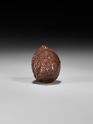 Lot 320 - A VERY FINE KURUMI (WALNUT) NETSUKE WITH SHISHI AND PEONY