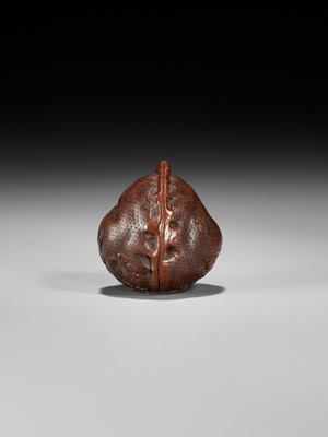 Lot 320 - A VERY FINE KURUMI (WALNUT) NETSUKE WITH SHISHI AND PEONY