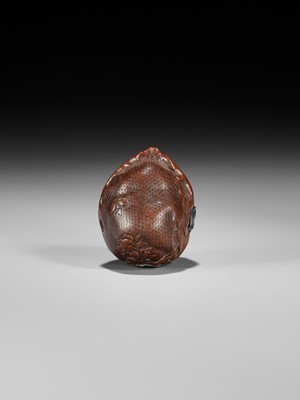 Lot 320 - A VERY FINE KURUMI (WALNUT) NETSUKE WITH SHISHI AND PEONY