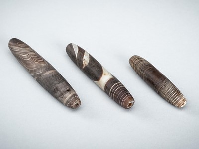 Lot 1663 - A GROUP OF THREE WESTERN ASIATIC BANDED AGATE BEADS, 1ST MILLENNIUM BC OR EARLIER