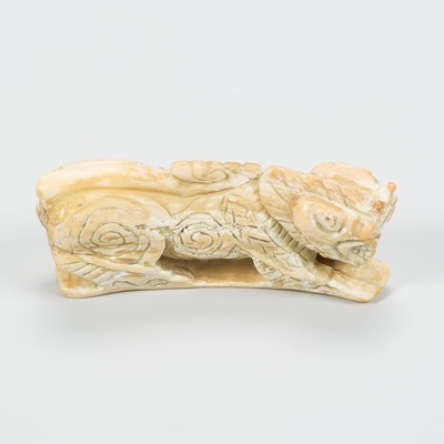 Lot 1035 - A MARINE IVORY FIGURE OF A SINGHA, 17th CENTURY