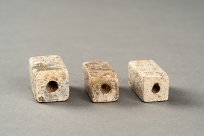 Lot 123 - A GROUP OF THREE ARCHAISTIC CONG-FORM BEADS