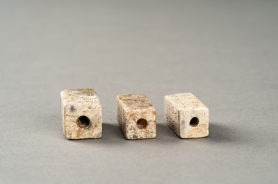 Lot 123 - A GROUP OF THREE ARCHAISTIC CONG-FORM BEADS