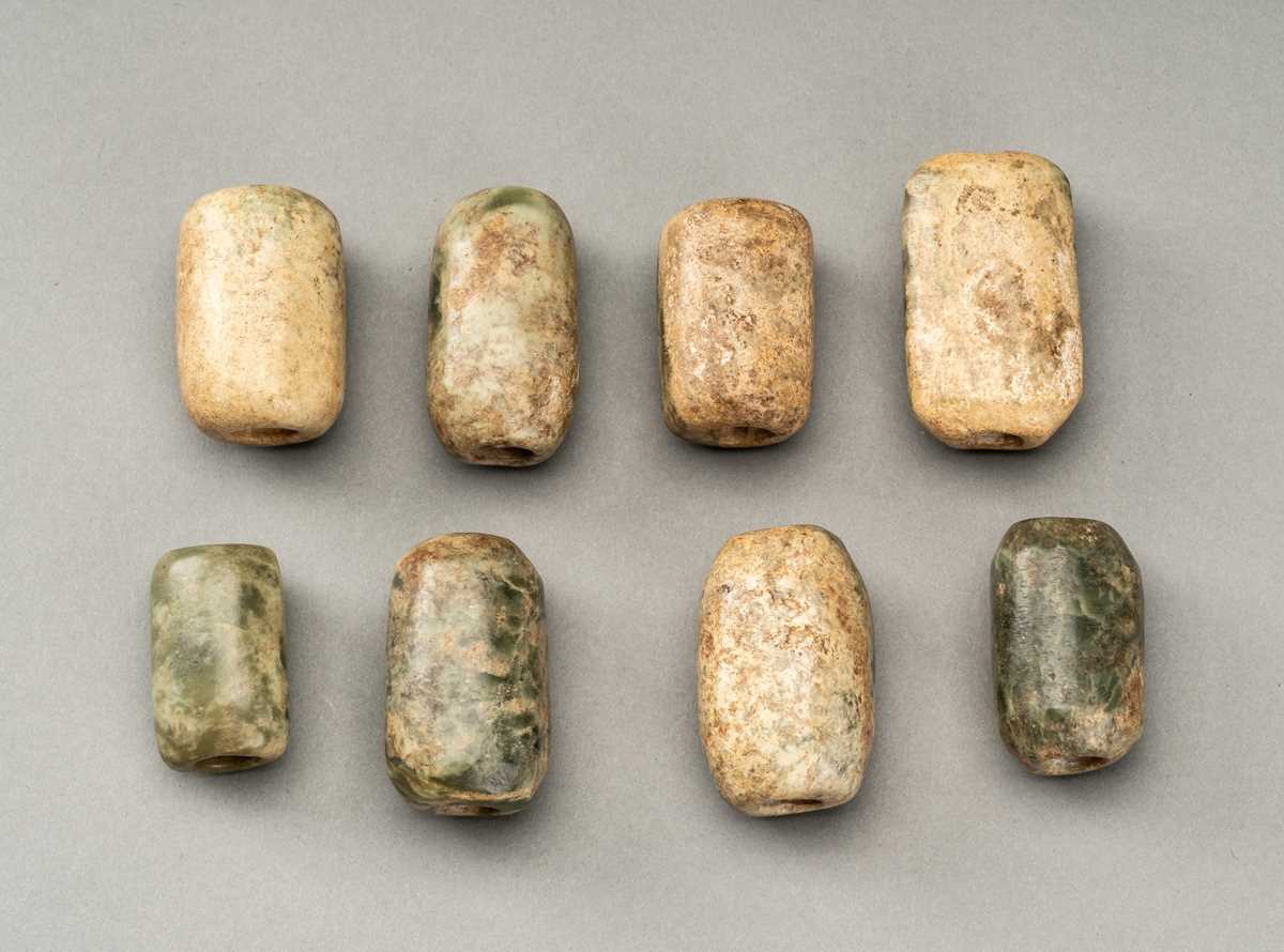 Lot 83 - A LOT WITH EIGHT ANCIENT CHINESE JADE BEADS