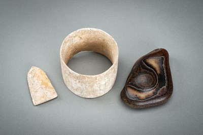 Lot 74 - A LOT WITH THREE CHINESE NEOLITHIC ITEMS