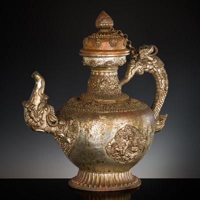 Lot 25 - A MASSIVE SILVERED-COPPER RITUAL TEAPOT AND COVER, TIBET, 19TH CENTURY
