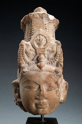 Lot 683 - A RED SANDSTONE HEAD OF VISHNU WITH A MITER CROWN