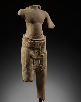 Lot 275 - A SANDSTONE TORSO OF A MALE DEITY, KHMER, ANGKOR PERIOD