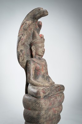 Lot 1435 - AN ANGKOR-STYLE STONE FIGURE OF BUDDHA MUCHALINDA