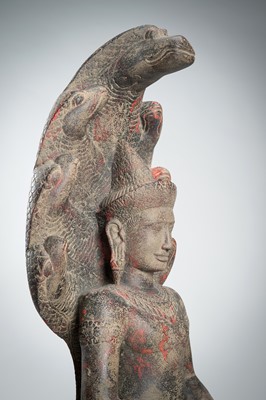 Lot 1435 - AN ANGKOR-STYLE STONE FIGURE OF BUDDHA MUCHALINDA