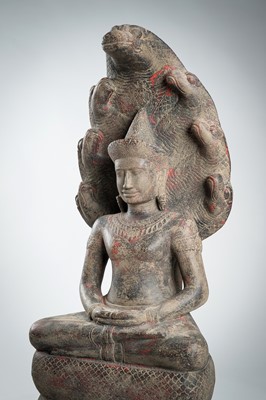 Lot 1435 - AN ANGKOR-STYLE STONE FIGURE OF BUDDHA MUCHALINDA