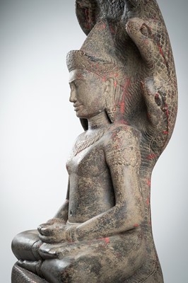 Lot 1435 - AN ANGKOR-STYLE STONE FIGURE OF BUDDHA MUCHALINDA