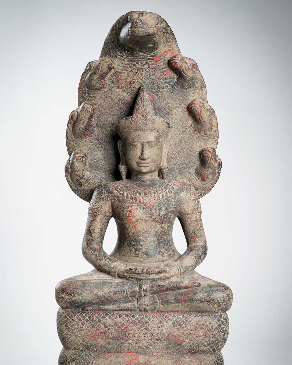 Lot 1435 - AN ANGKOR-STYLE STONE FIGURE OF BUDDHA MUCHALINDA