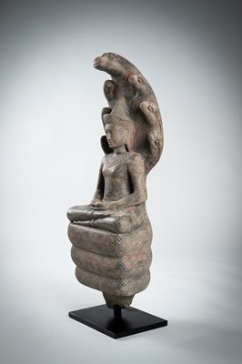 Lot 1435 - AN ANGKOR-STYLE STONE FIGURE OF BUDDHA MUCHALINDA