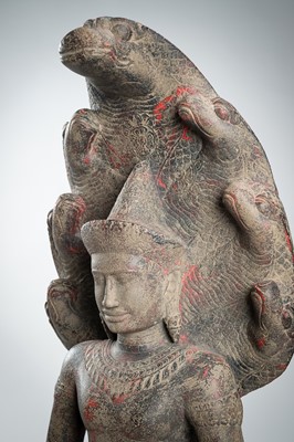 Lot 1435 - AN ANGKOR-STYLE STONE FIGURE OF BUDDHA MUCHALINDA