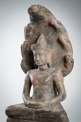 Lot 1435 - AN ANGKOR-STYLE STONE FIGURE OF BUDDHA MUCHALINDA