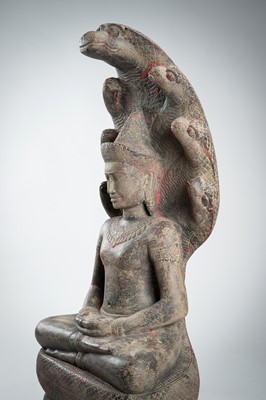 Lot 1435 - AN ANGKOR-STYLE STONE FIGURE OF BUDDHA MUCHALINDA