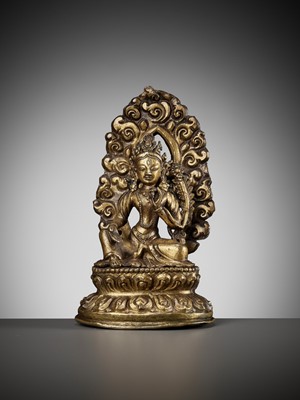Lot 673 - A GILT COPPER REPOUSSÉ FIGURE OF TARA, NEPAL, 18TH-19TH CENTURY