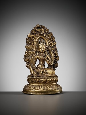 Lot 673 - A GILT COPPER REPOUSSÉ FIGURE OF TARA, NEPAL, 18TH-19TH CENTURY