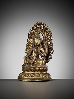 Lot 673 - A GILT COPPER REPOUSSÉ FIGURE OF TARA, NEPAL, 18TH-19TH CENTURY