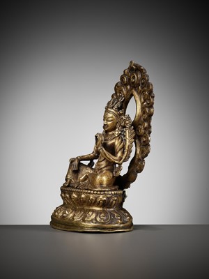 Lot 673 - A GILT COPPER REPOUSSÉ FIGURE OF TARA, NEPAL, 18TH-19TH CENTURY