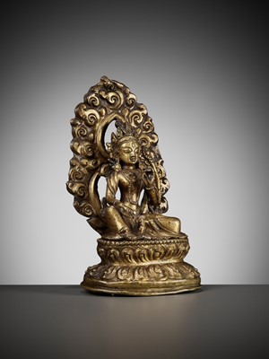 Lot 673 - A GILT COPPER REPOUSSÉ FIGURE OF TARA, NEPAL, 18TH-19TH CENTURY
