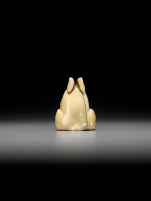 Lot 146 - YOSHINAGA: AN IVORY NETSUKE OF A CROUCHING RABBIT