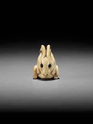 Lot 146 - YOSHINAGA: AN IVORY NETSUKE OF A CROUCHING RABBIT