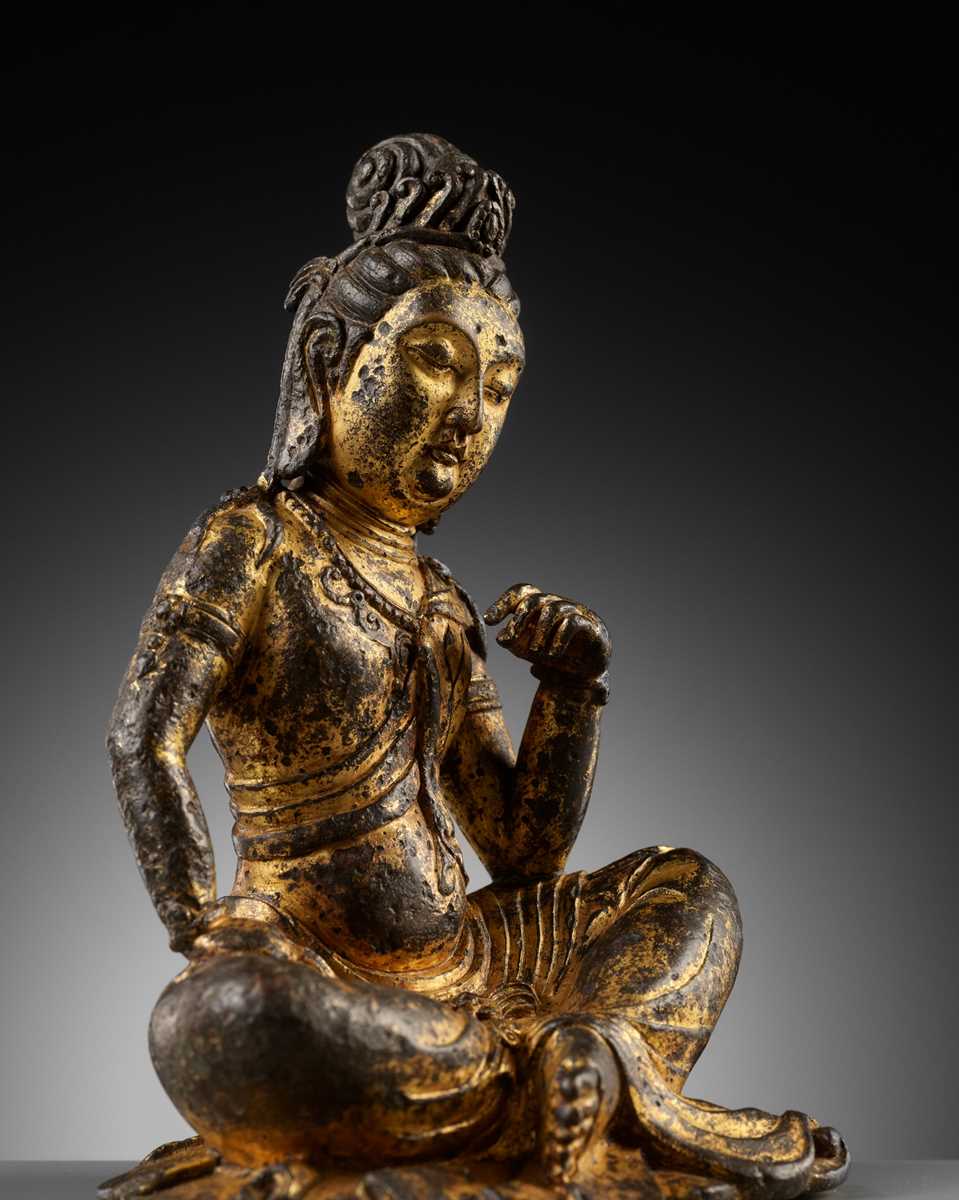 Lot 60 - A GILT BRONZE FIGURE OF GUANYIN, PROBABLY TANG DYNASTY