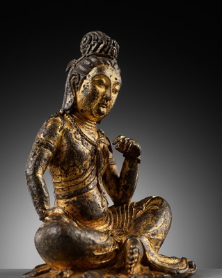 Lot 60 - A GILT BRONZE FIGURE OF GUANYIN, PROBABLY TANG DYNASTY