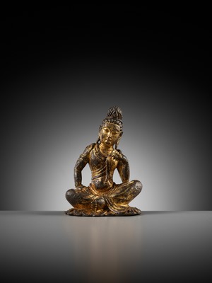 Lot 60 - A GILT BRONZE FIGURE OF GUANYIN, PROBABLY TANG DYNASTY